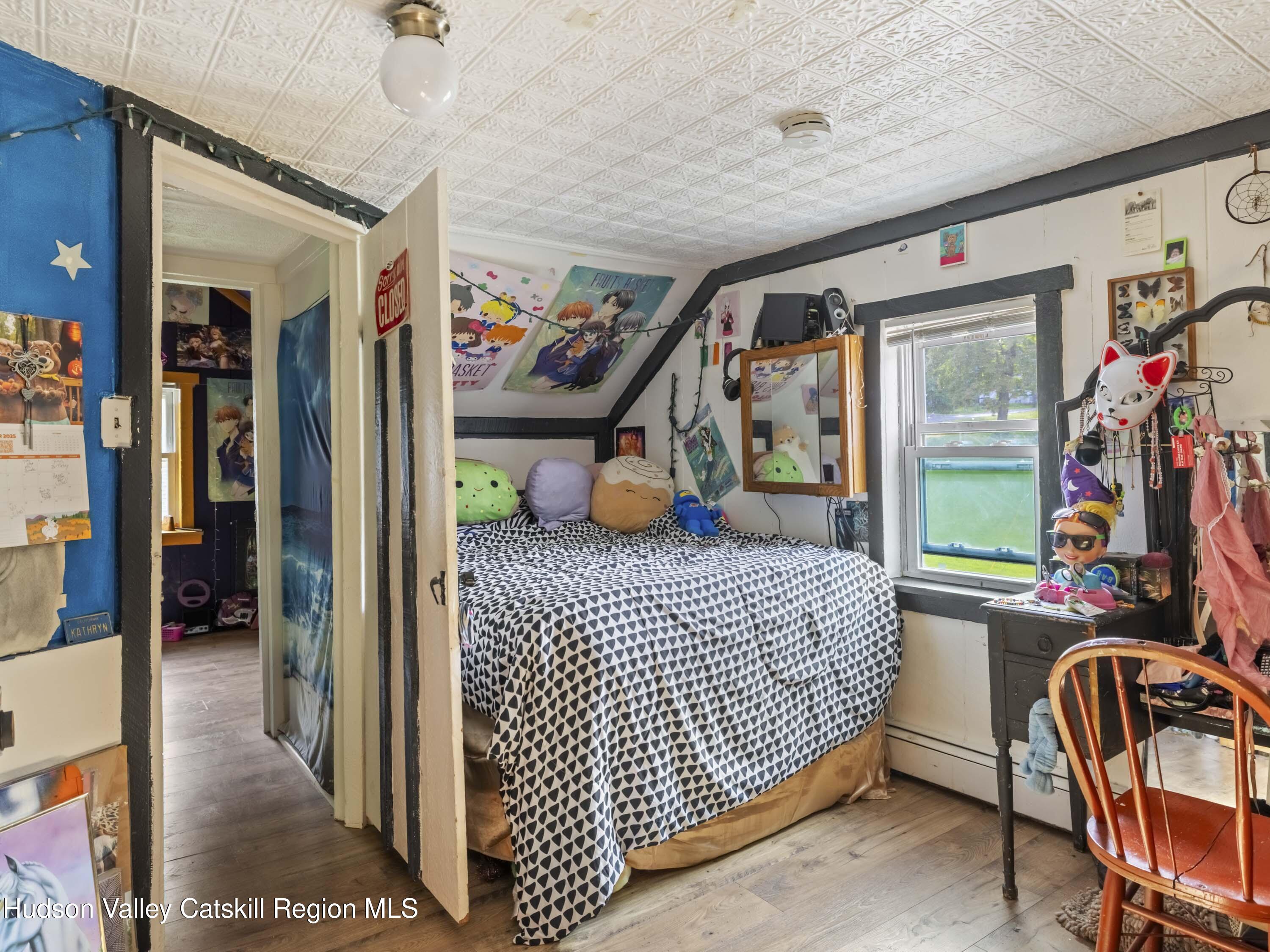 311 Spring Street Port Ewen, NY 12466 - Photo 25 of 45 a bedroom with a bed and a walk in closet