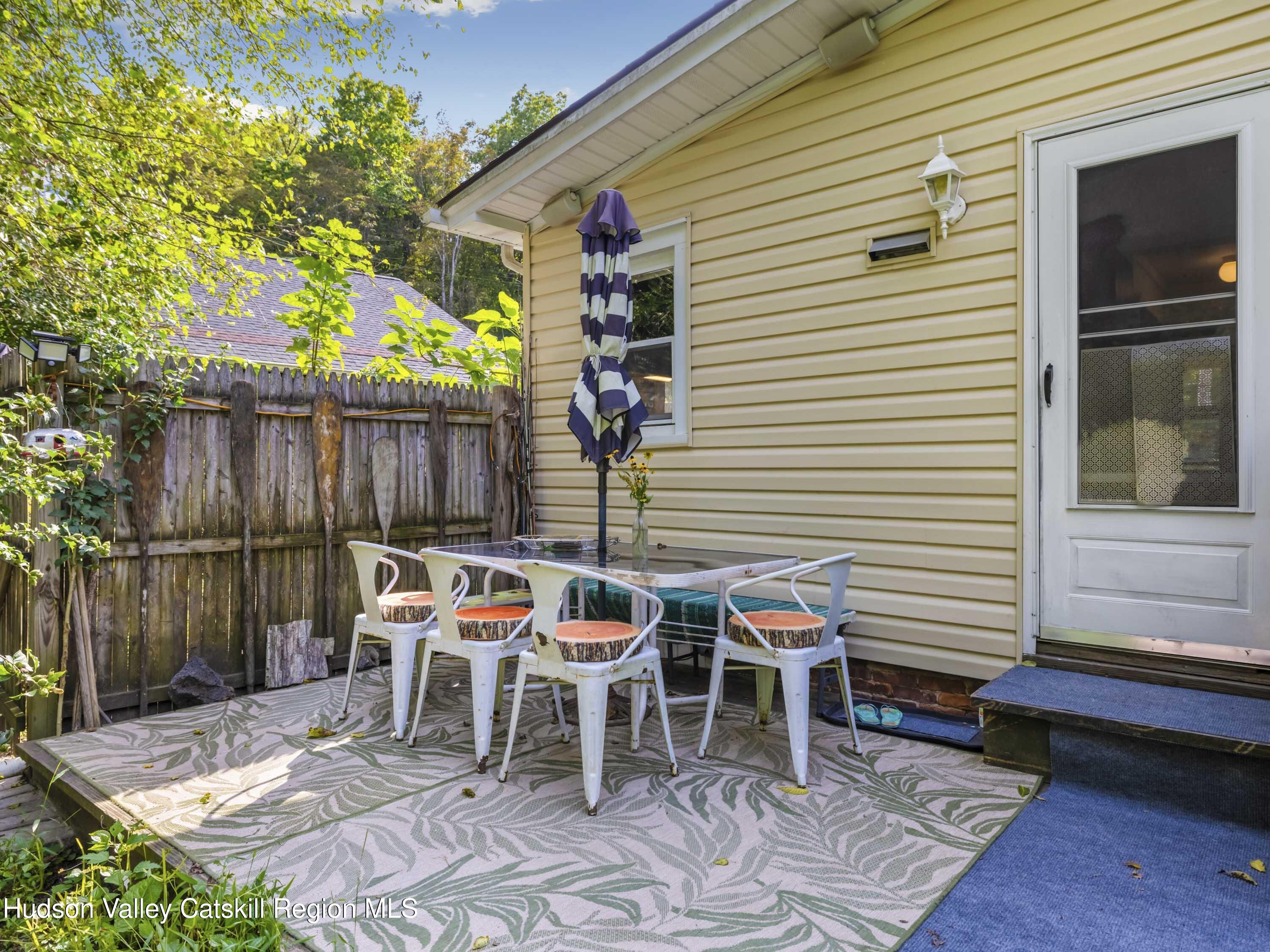 311 Spring Street Port Ewen, NY 12466 - Photo 27 of 45 a patio with table and chairs and potted plants