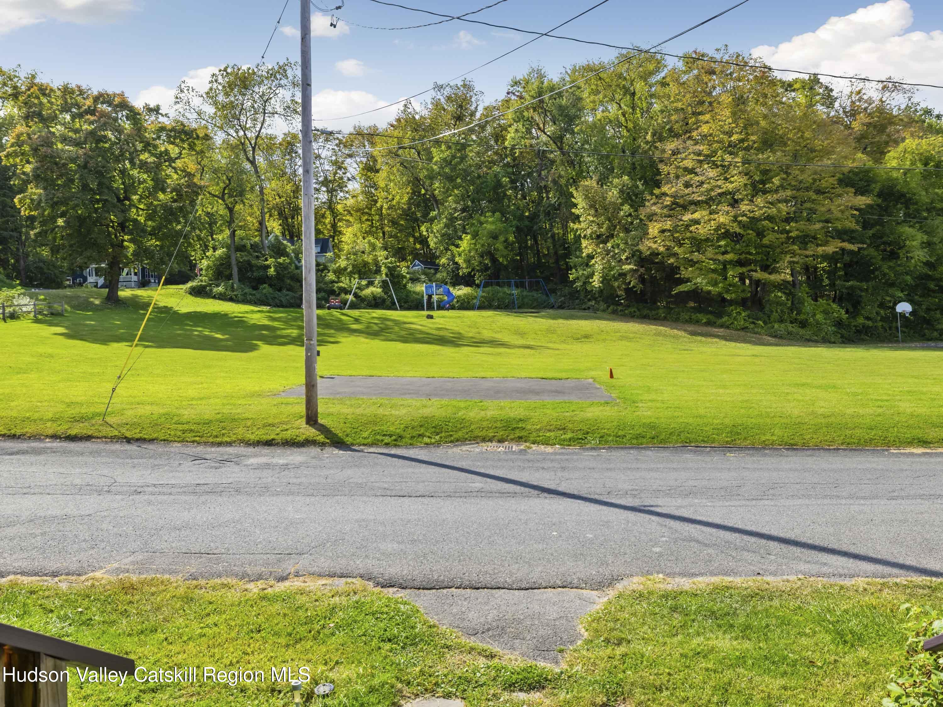 311 Spring Street Port Ewen, NY 12466 - Photo 7 of 45 a view of a yard with a large trees