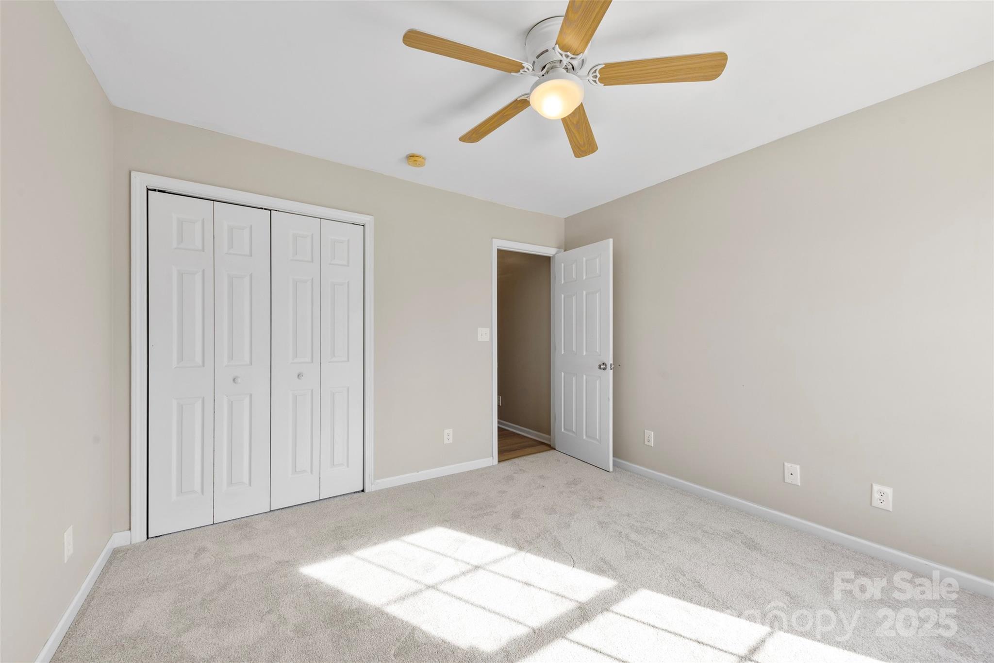 106 Springfield Drive Gaffney, SC 29341 - Photo 23 of 31 an empty room with closet and a ceiling fan