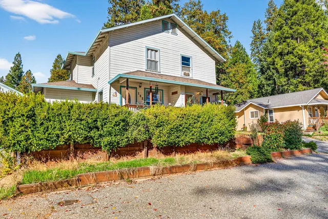 front view of a house with a yard