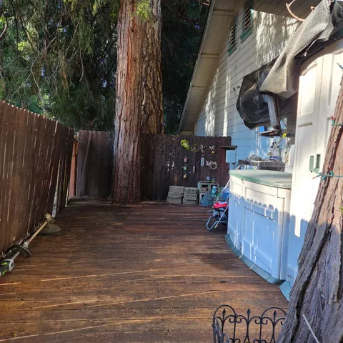 a view of outdoor space and wooden deck