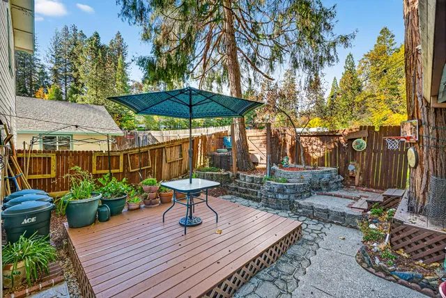 a view of a backyard with sitting area and furniture