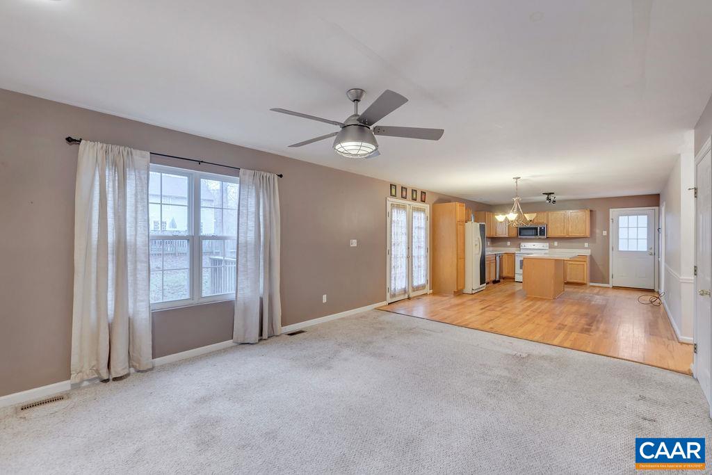 46 Laguna Road Palmyra, VA 22963 - Photo 6 of 37 a view of an empty room with a window and a kitchen