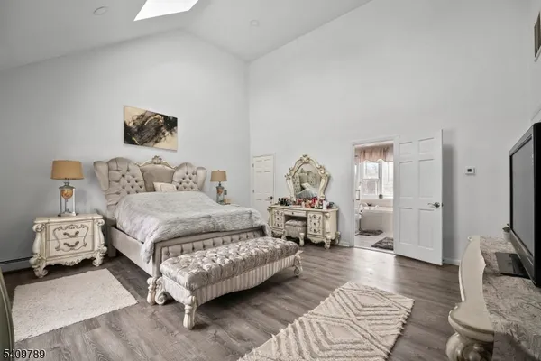 a bedroom with a bed and a couch