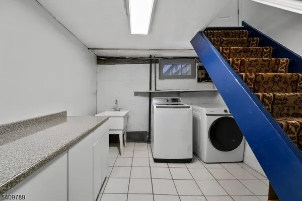 a kitchen with a stove and white cabinets