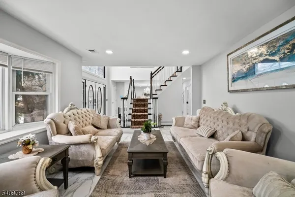 a living room with furniture and a large window