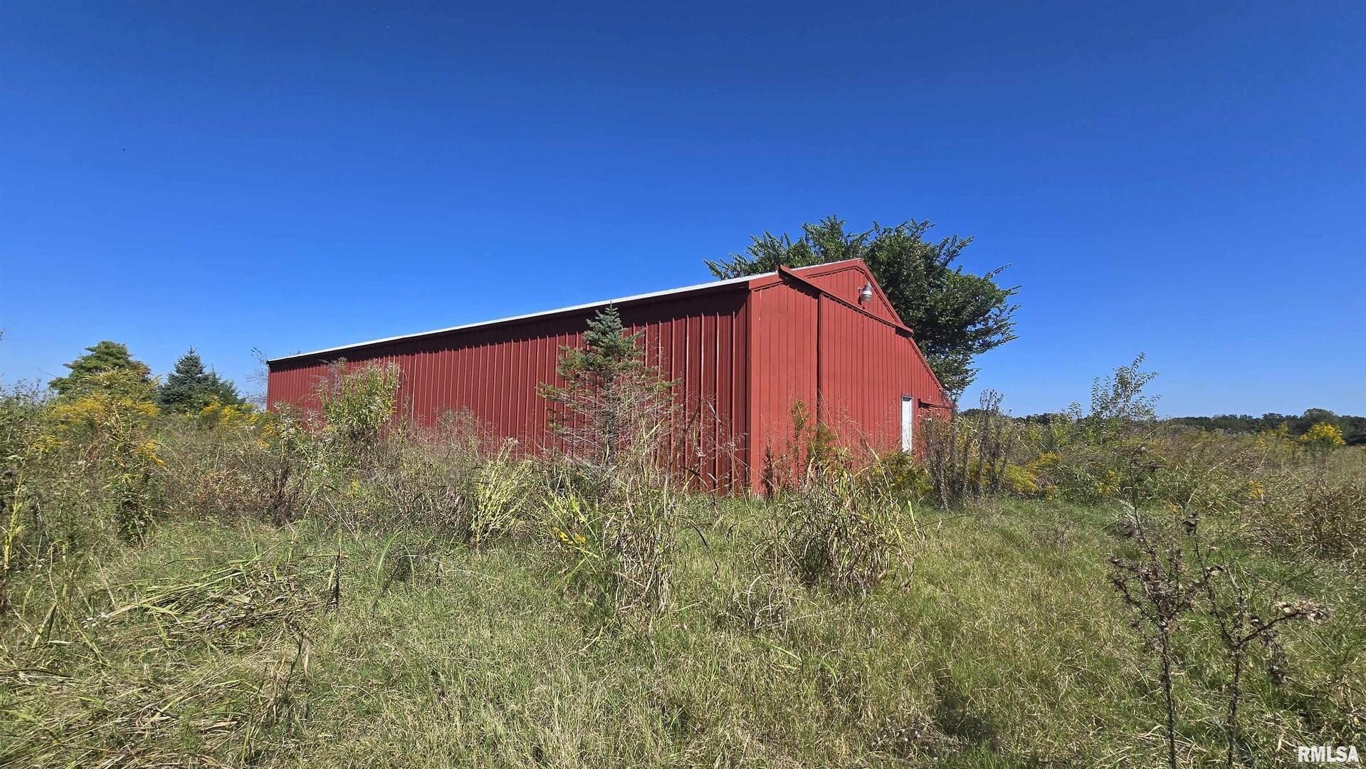0 Mt Pisgah Road Vienna, IL 62995 - Photo 2 of 24 a view of a tall building in a yard