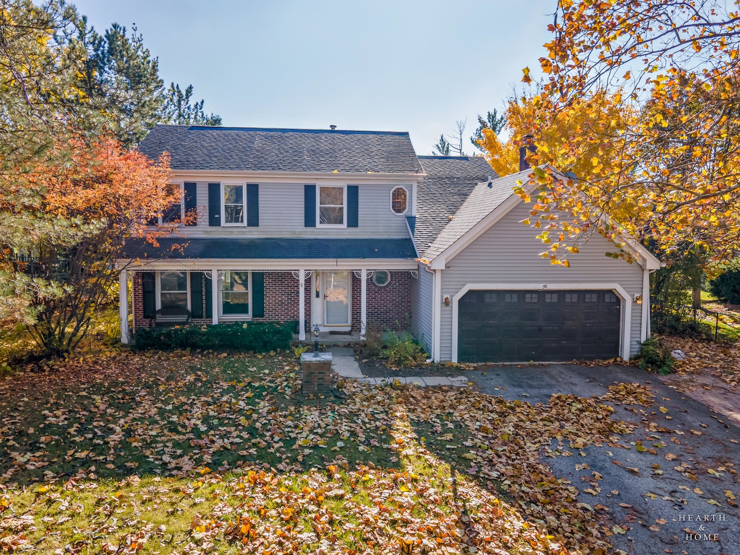 56 Huntcliff Court Fox River Grove, IL 60021 - Photo 1 of 42 a front view of a house with a garden