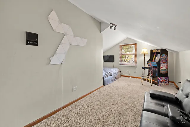 a bedroom with furniture and a window