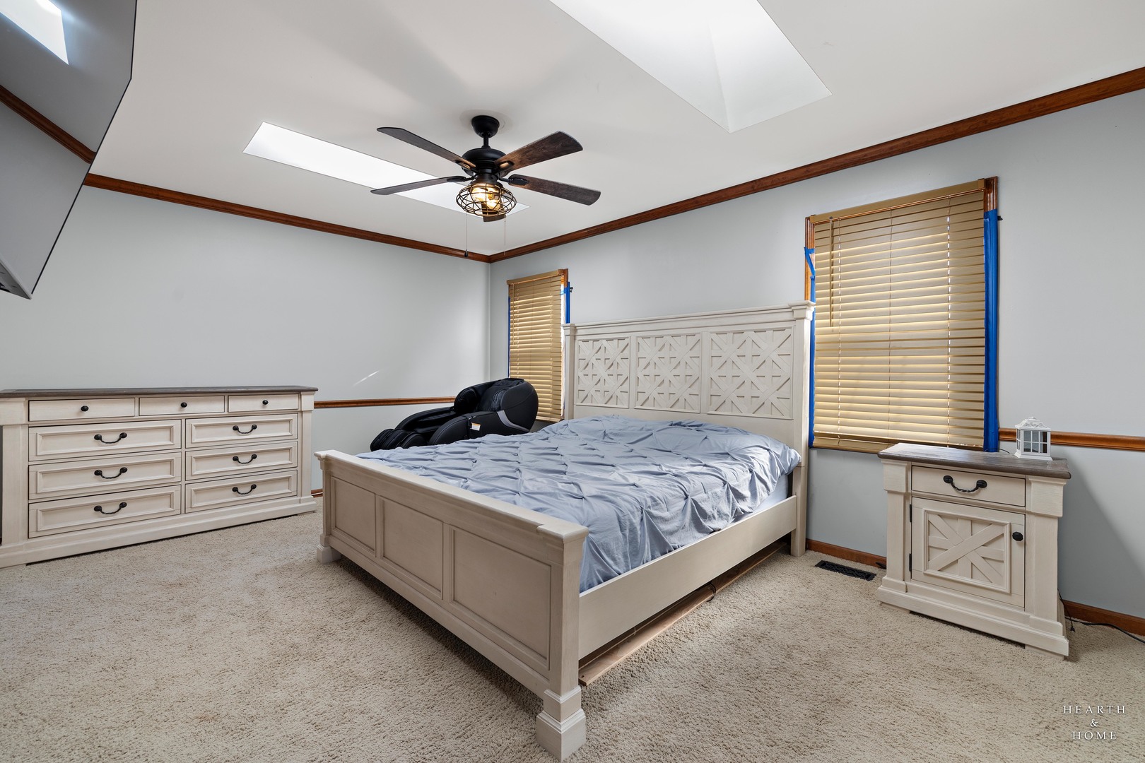 56 Huntcliff Court Fox River Grove, IL 60021 - Photo 24 of 42 a bedroom with a bed and a chandelier