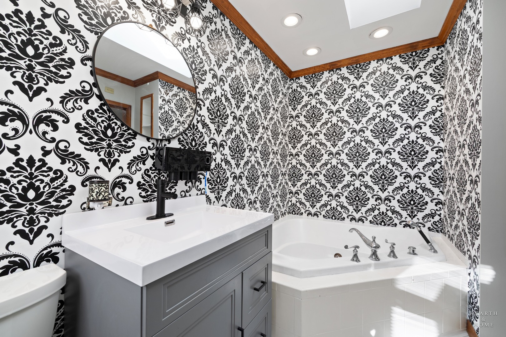 56 Huntcliff Court Fox River Grove, IL 60021 - Photo 27 of 42 a bathroom with a sink and a mirror
