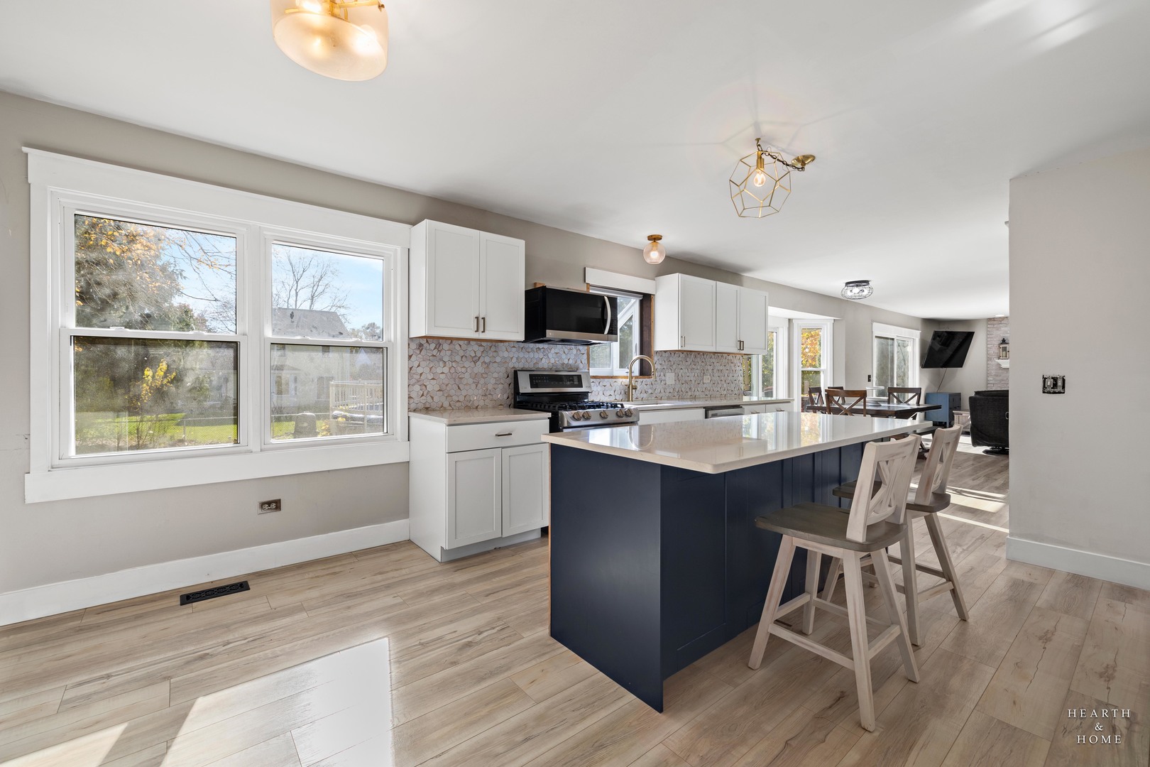 56 Huntcliff Court Fox River Grove, IL 60021 - Photo 8 of 42 a kitchen with stainless steel appliances granite countertop a stove top oven a sink dishwasher a refrigerator and white cabinets with wooden floor