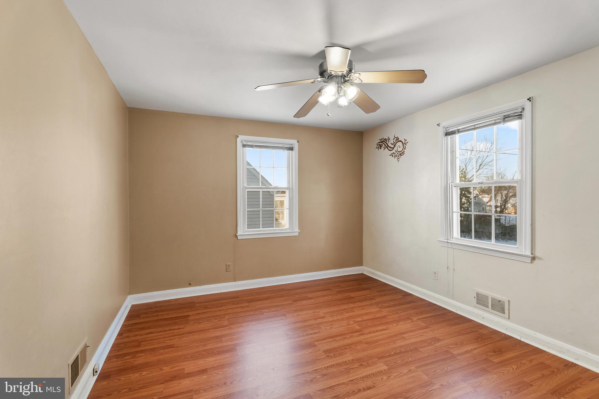 3823 Byfield Road Gwynn Oak, MD 21207 - Photo 12 of 42 a view of an empty room with wooden floor and a window