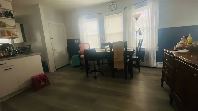 a view of a dining room with furniture and window