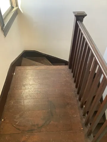 a view of staircase and utility room