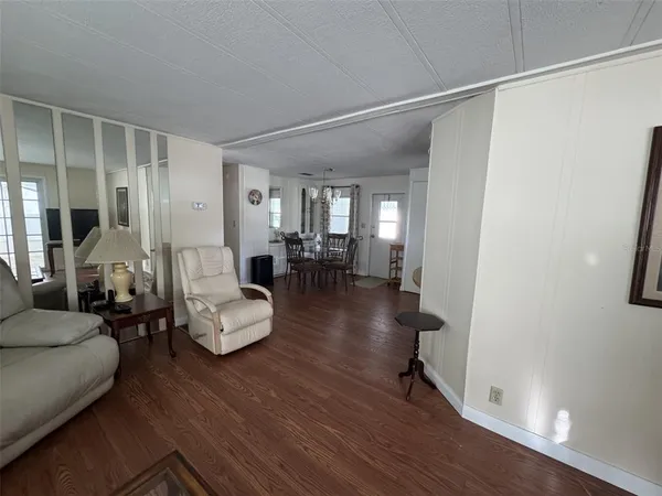 a view of a dining room with furniture and window