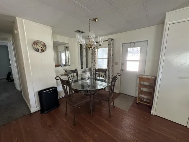 a bedroom with a bed and a mirror