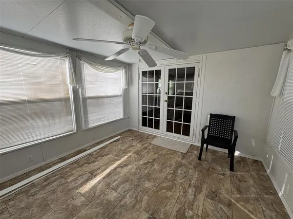 a view of an empty room and window