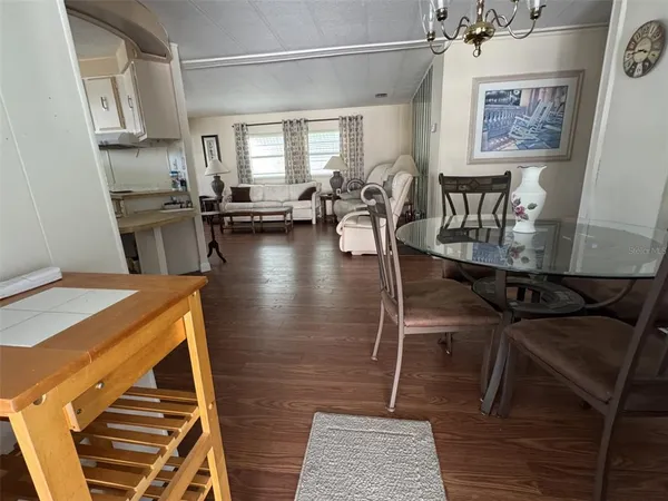 a kitchen with stainless steel appliances a refrigerator and a stove top oven