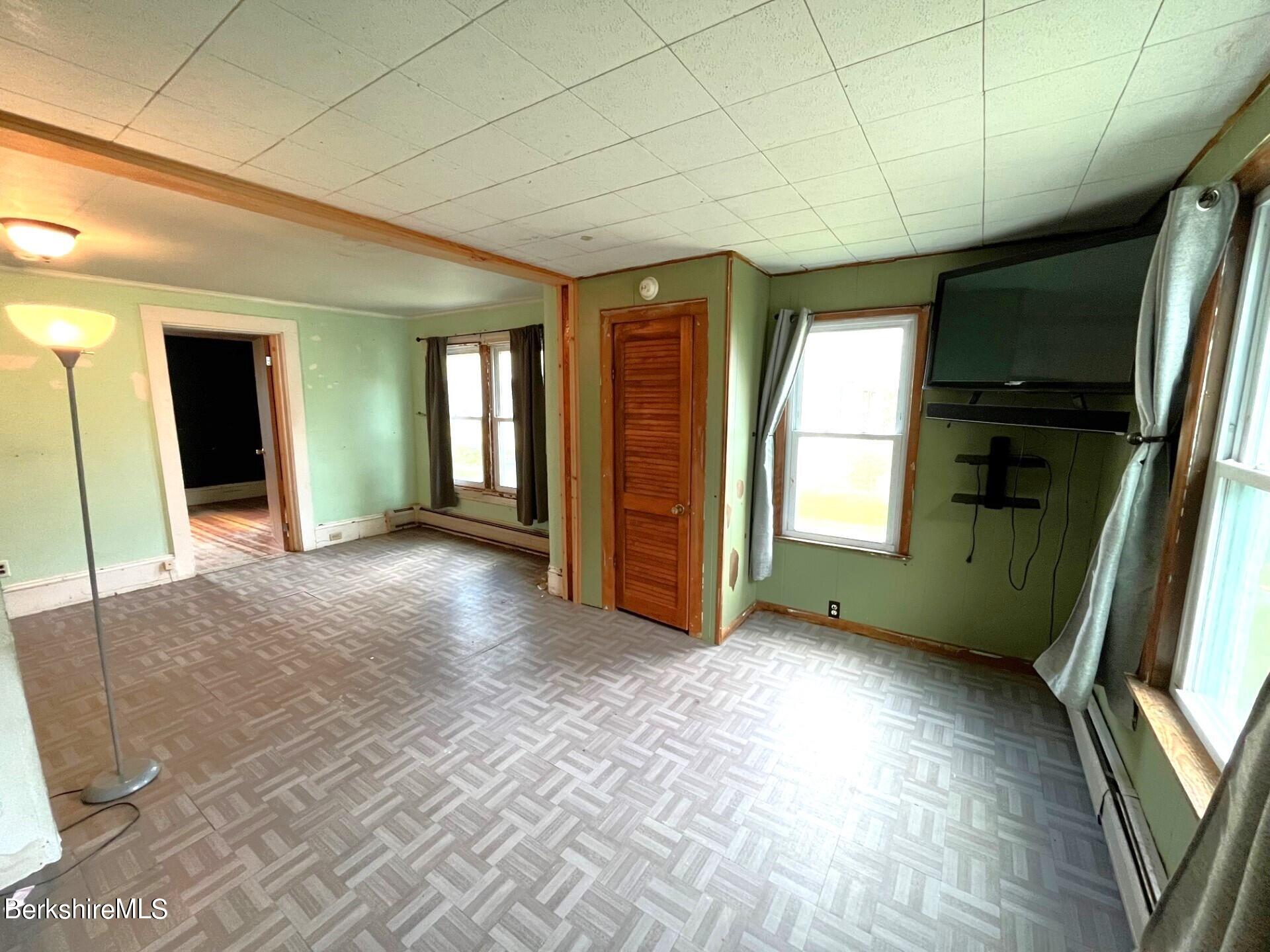 11 Goodrich Street North Adams, MA 01247 - Photo 5 of 35 a view of a livingroom with an empty space and a window