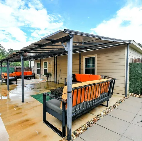 a backyard of a house with swimming pool table and chairs