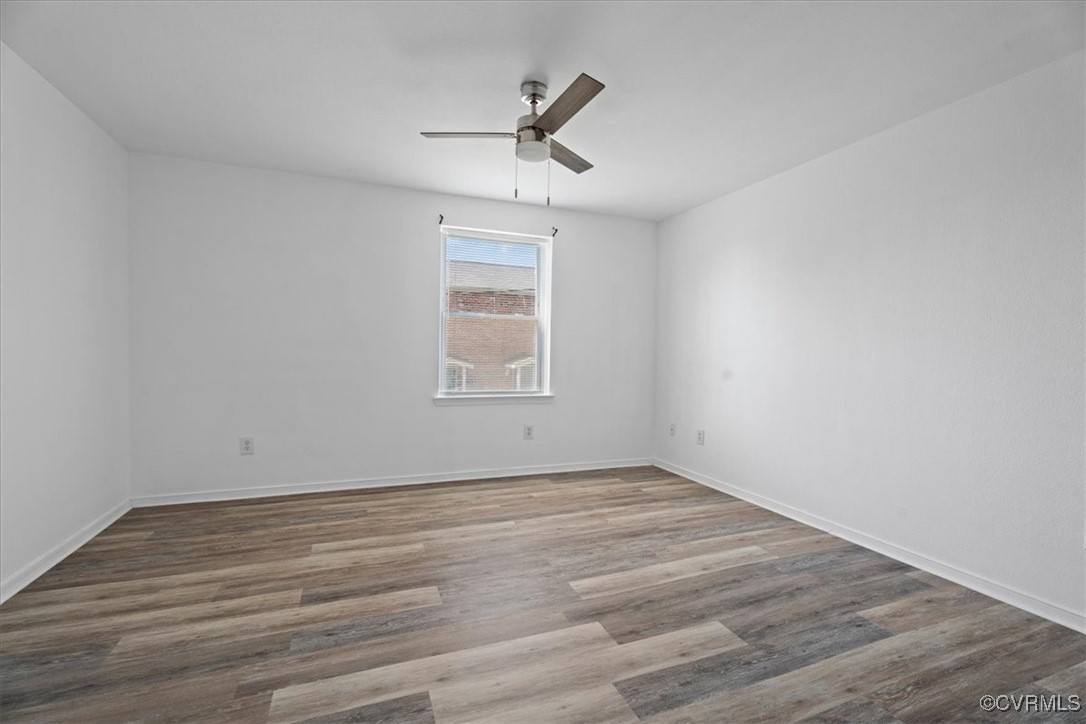 3510 East Richmond Road, Unit U3 Richmond, VA 23223 - Photo 17 of 20 an empty room with wooden floor ceiling fan and windows