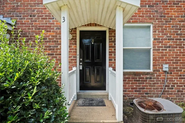 a front view of a house with a door and a window