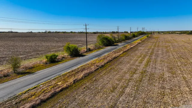a view of a balcony with wooden floor and outdoor space