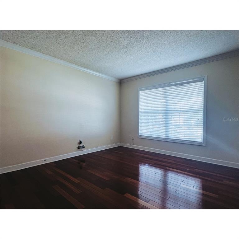 4876 South Conway Road, Unit 94 Orlando, FL 32812 - Photo 13 of 13 a black and white photo of a living room