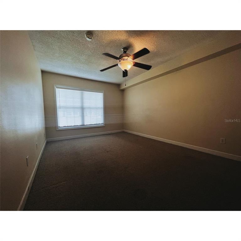 4876 South Conway Road, Unit 94 Orlando, FL 32812 - Photo 5 of 13 a black and white photo of a living room