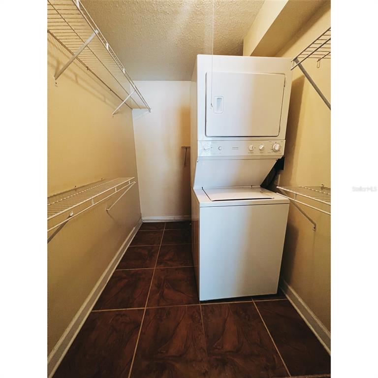4876 South Conway Road, Unit 94 Orlando, FL 32812 - Photo 7 of 13 a utility room with dryer and washer