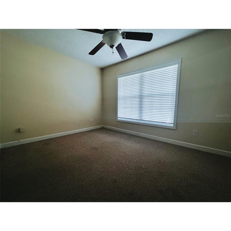 4876 South Conway Road, Unit 94 Orlando, FL 32812 - Photo 9 of 13 a black and white photo of a living room