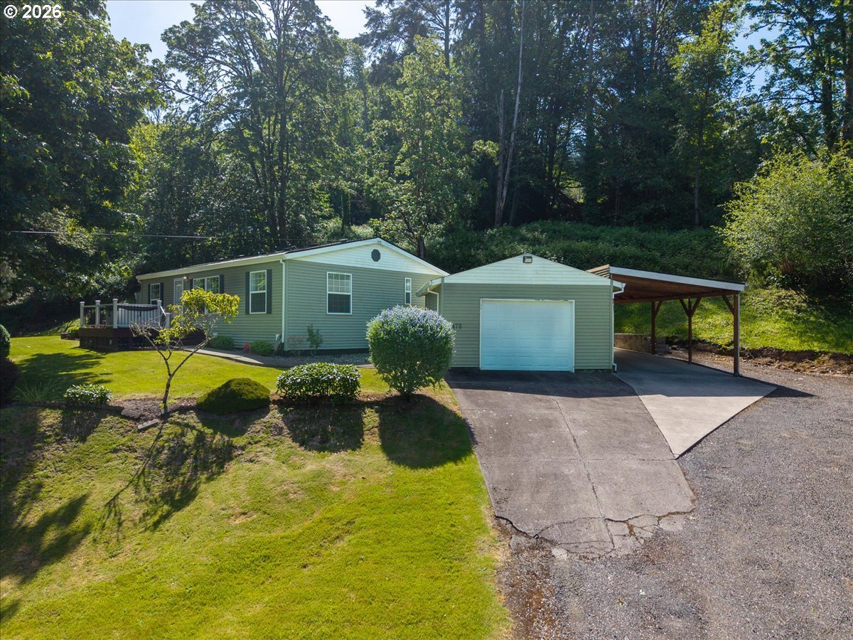 475 East 9th Street Rainier, OR 97048 - Photo 2 of 43 a view of a house with swimming pool and a yard