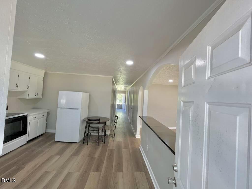 185 Summerhill Road Turkey, NC 28393 - Photo 4 of 18 a kitchen with a sink stainless steel appliances and cabinets