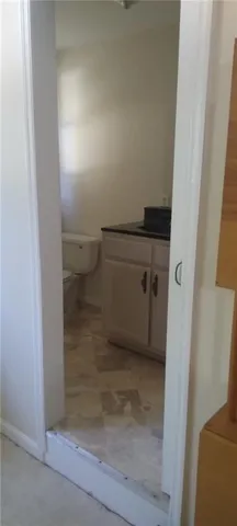 a view of storage and utility room with closet