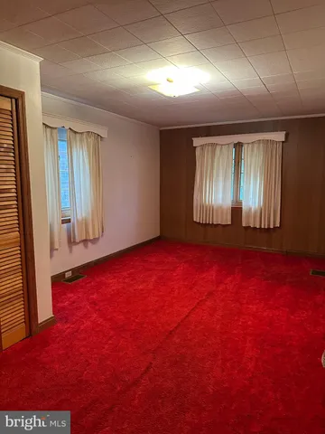 a white toilet sitting next to a sink