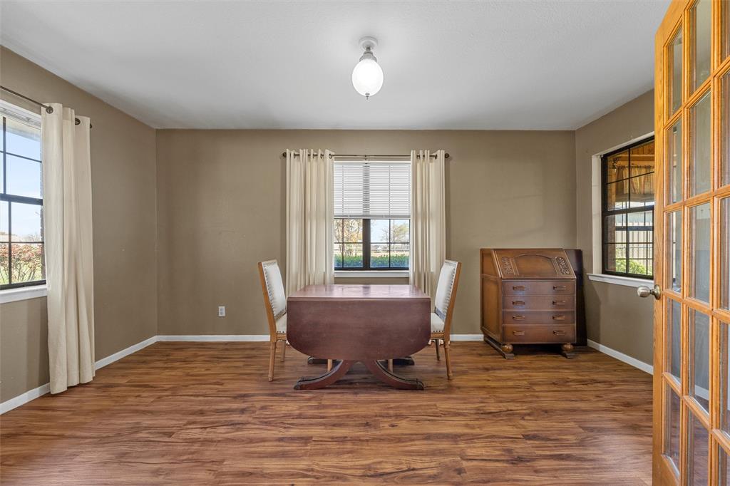 117 North 9th Street Lott, TX 76656 - Photo 9 of 28 Dining space with dark wood-type flooring and healthy amount of natural light