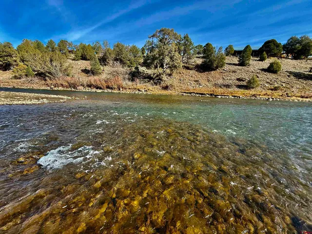 a view of lake with green space