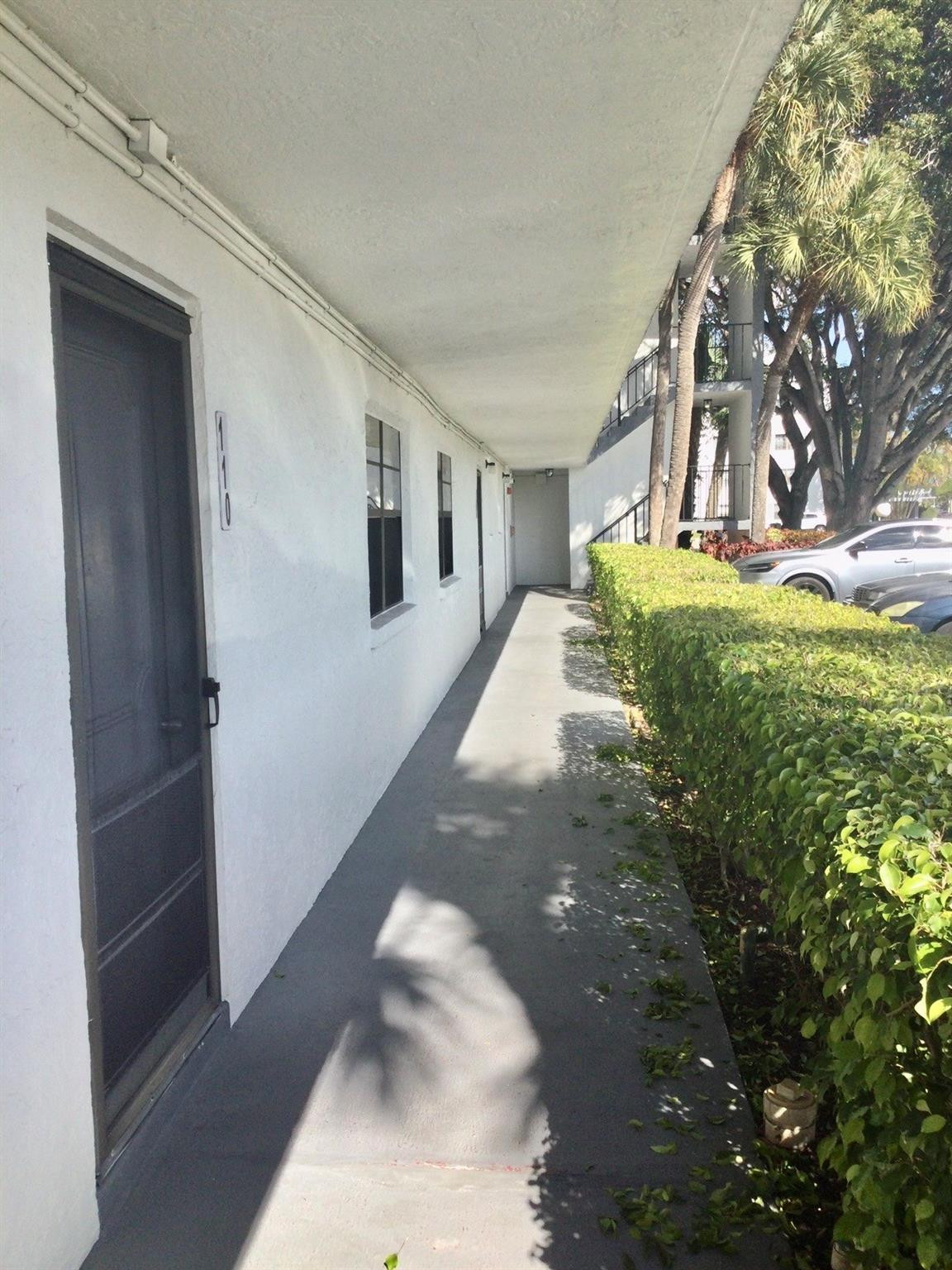 9233 Southwest 8th Street, Unit 110 Boca Raton, FL 33428 - Photo 1 of 14 a view of a porch of the house