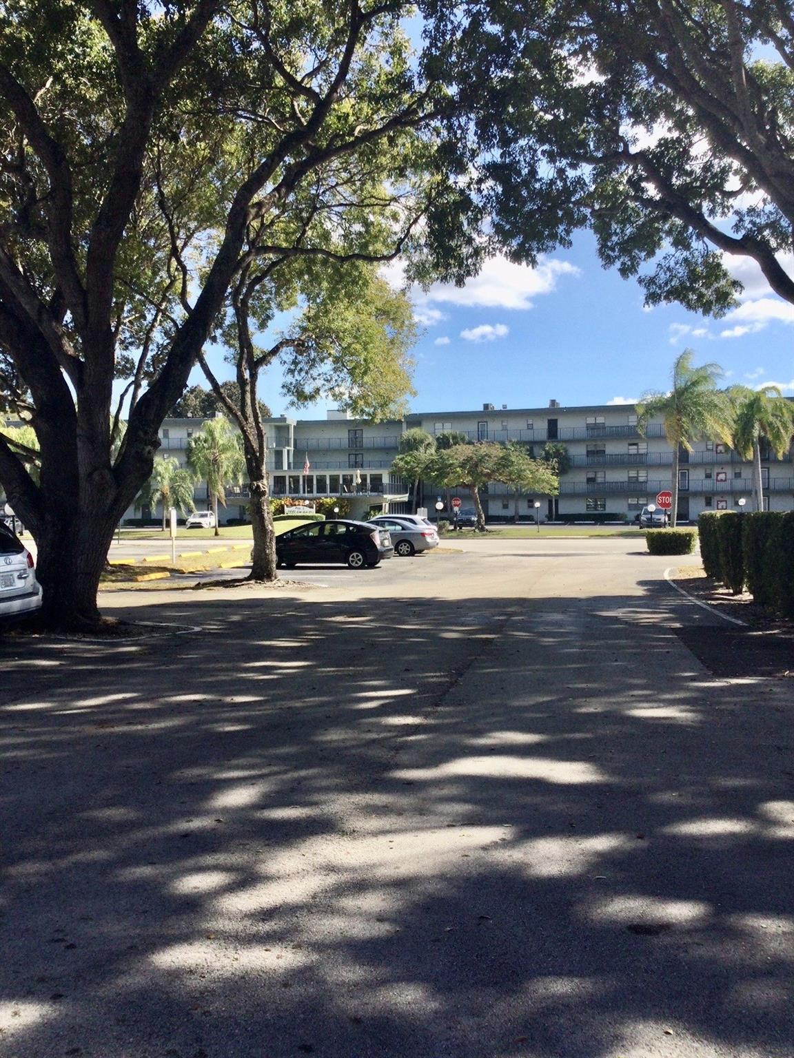 9233 Southwest 8th Street, Unit 110 Boca Raton, FL 33428 - Photo 11 of 14 a view of street with a fountain