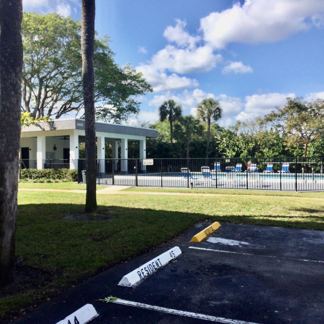 9233 Southwest 8th Street, Unit 110 Boca Raton, FL 33428 - Photo 12 of 14 a view of swimming pool is middle and garden