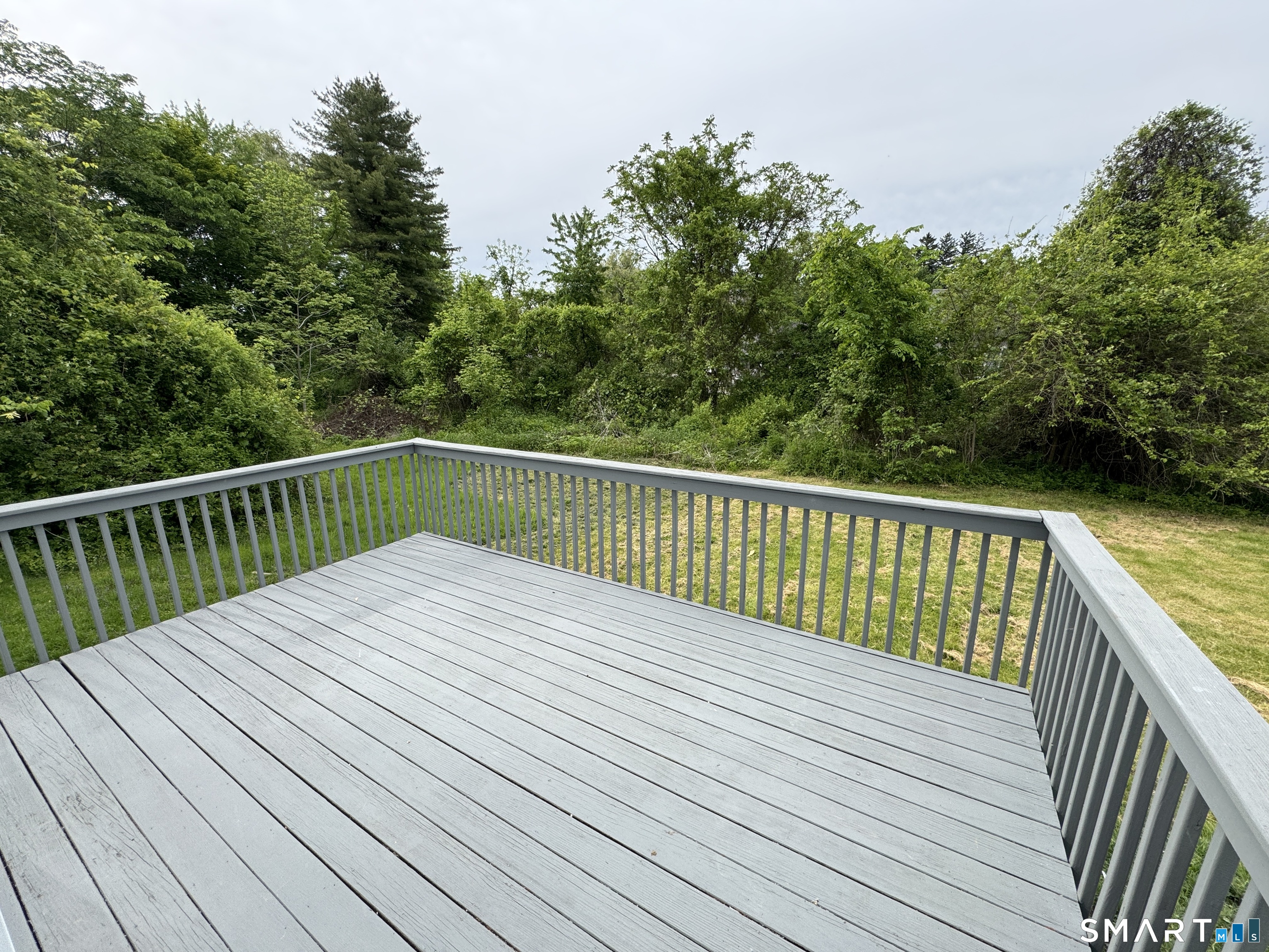 10 Center Street Windsor Locks, CT 06096 - Photo 20 of 25 a balcony with wooden floor and fence