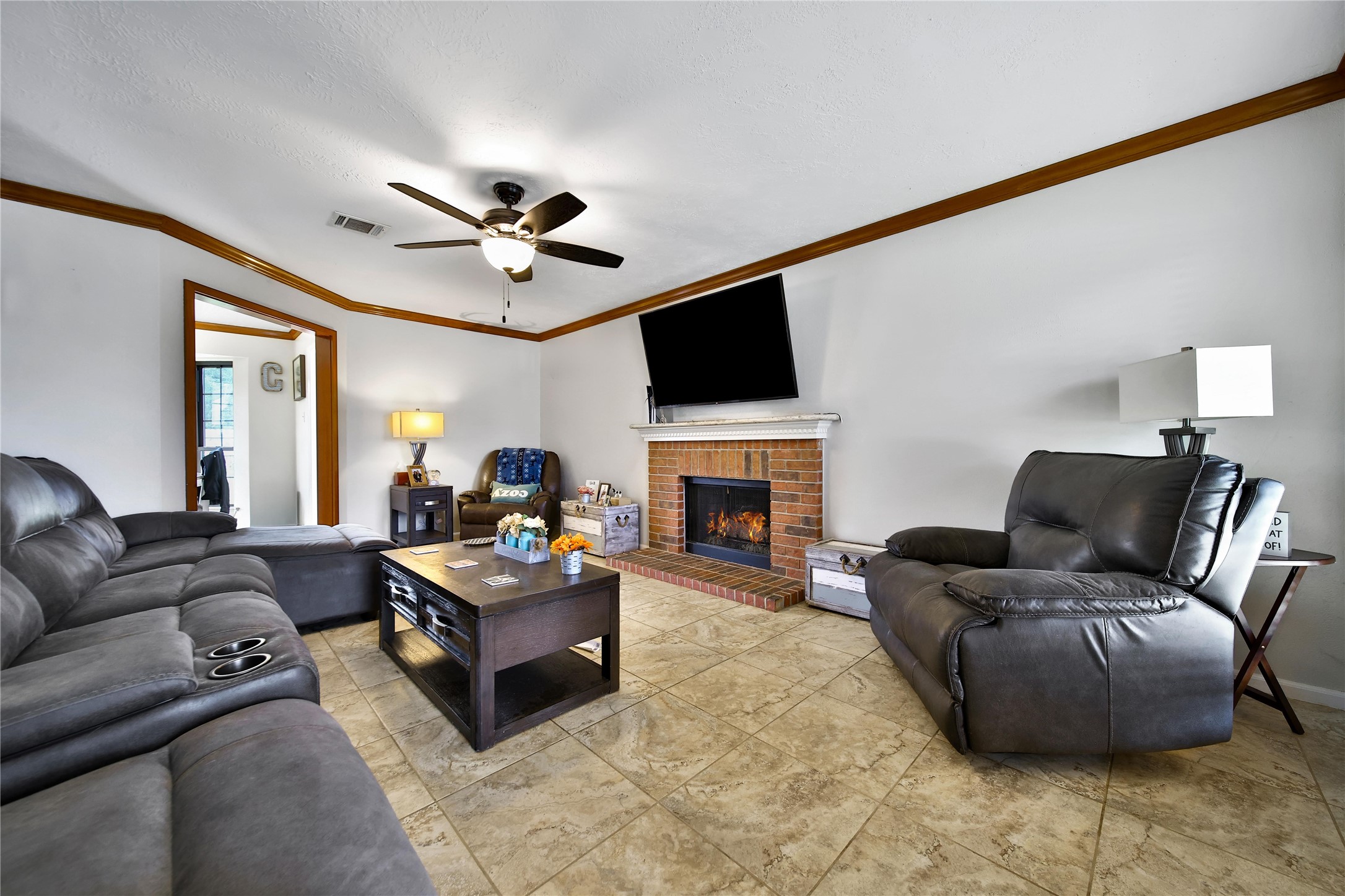 810 Noble Springs Road Houston, TX 77062 - Photo 14 of 27 a living room with furniture fireplace and a flat screen tv