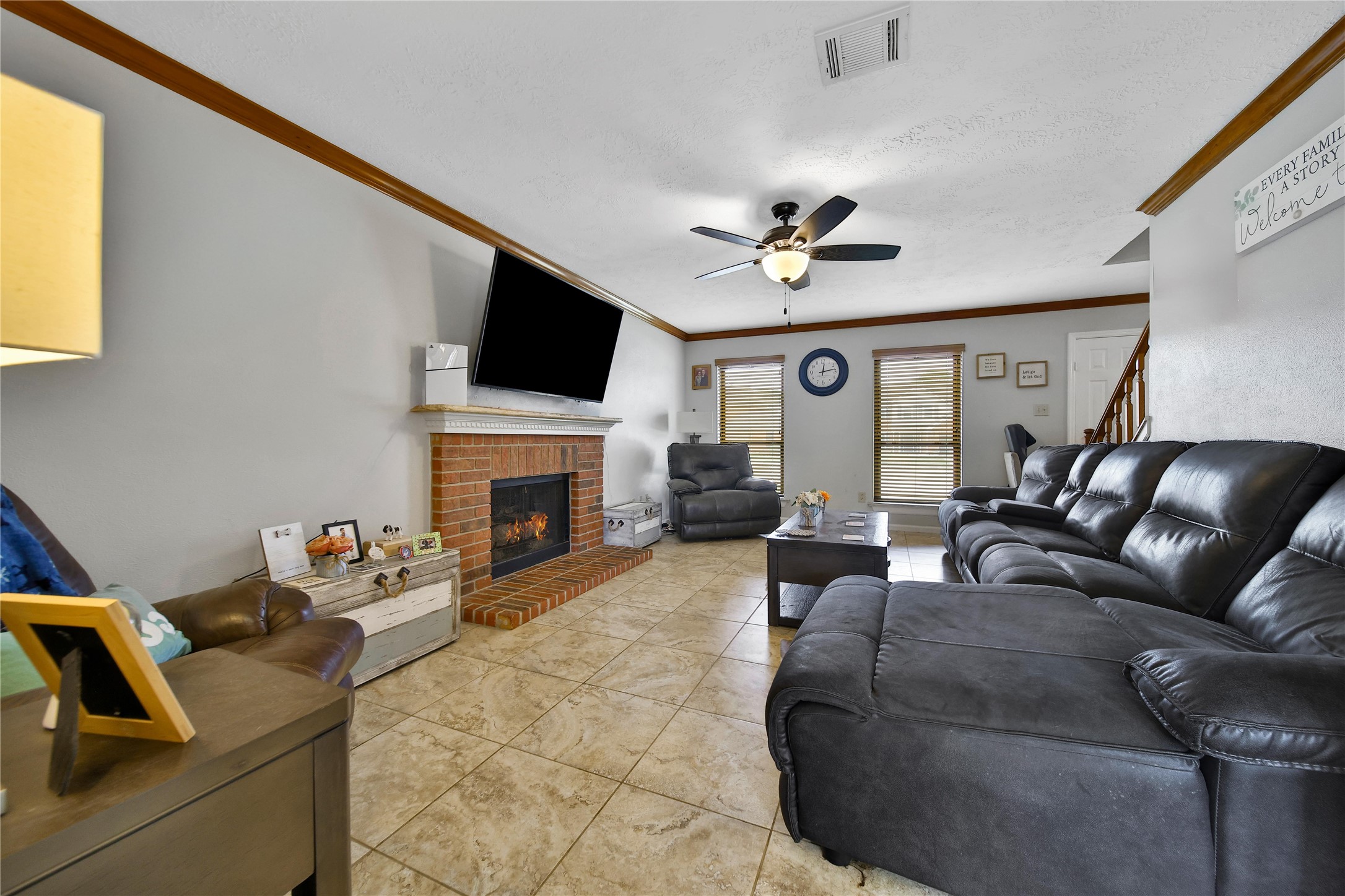 810 Noble Springs Road Houston, TX 77062 - Photo 15 of 27 a living room with furniture a fireplace and a flat screen tv