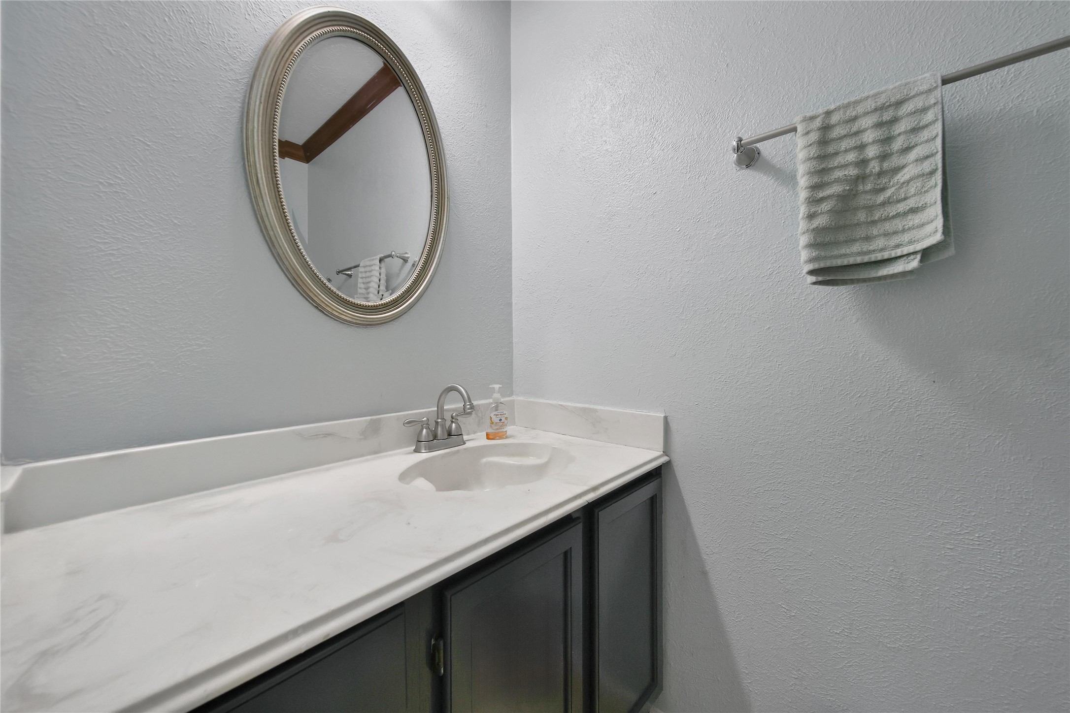 810 Noble Springs Road Houston, TX 77062 - Photo 16 of 27 a bathroom with a sink and a mirror