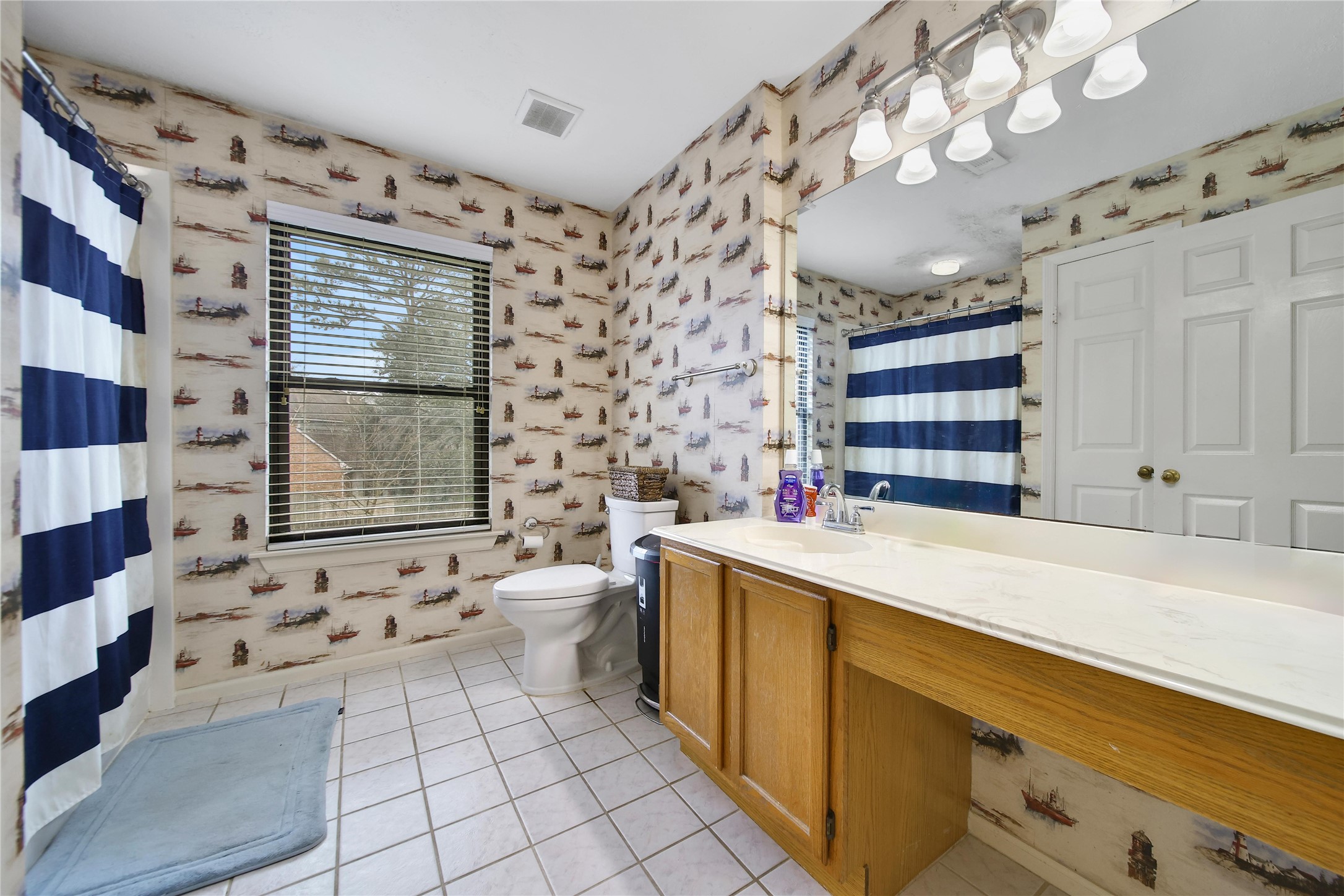 810 Noble Springs Road Houston, TX 77062 - Photo 21 of 27 a room with a sink and a large mirror