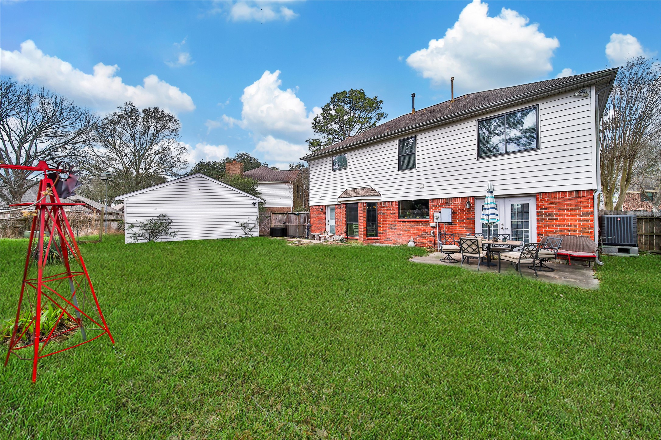 810 Noble Springs Road Houston, TX 77062 - Photo 26 of 27 a view of a house with backyard and a tree