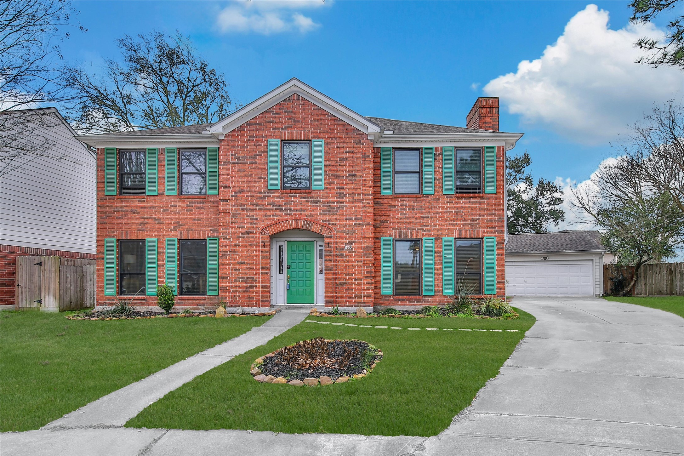 810 Noble Springs Road Houston, TX 77062 - Photo 3 of 27 front view of a brick house with a yard
