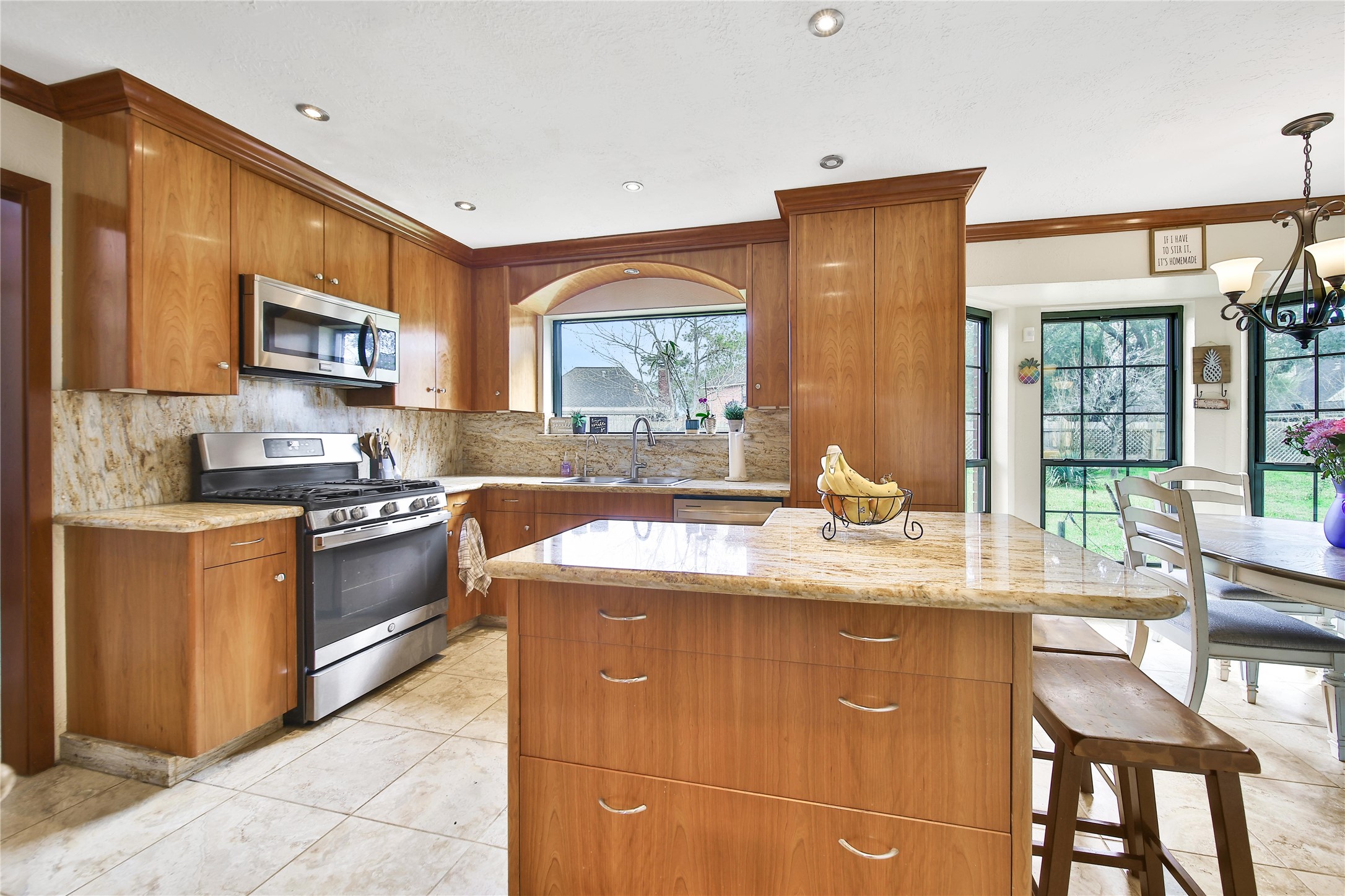 810 Noble Springs Road Houston, TX 77062 - Photo 6 of 27 a kitchen with stainless steel appliances granite countertop a sink stove and cabinets